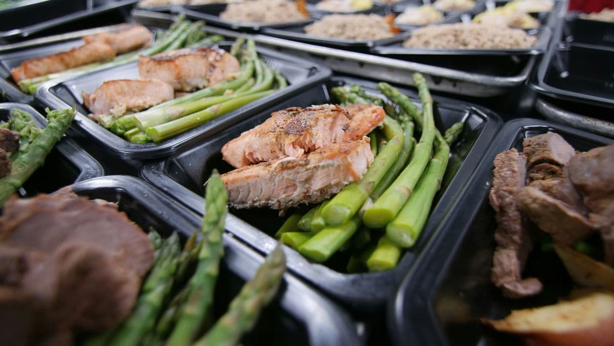 Salmon and beef meal prep containers with asparagus — easy meal prep for weight loss